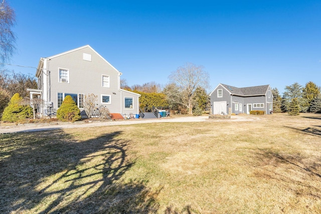 view of side of home with a lawn