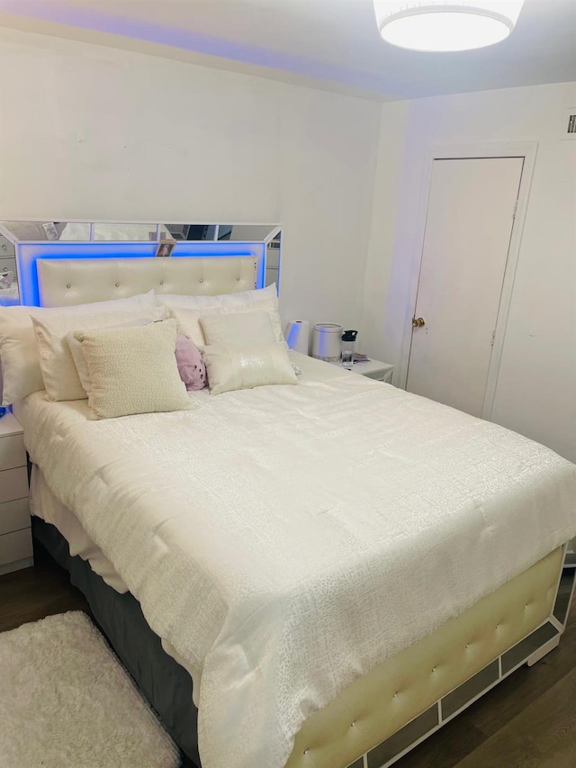 bedroom featuring hardwood / wood-style flooring