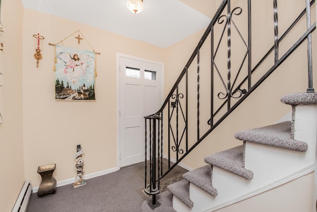 carpeted foyer featuring baseboard heating