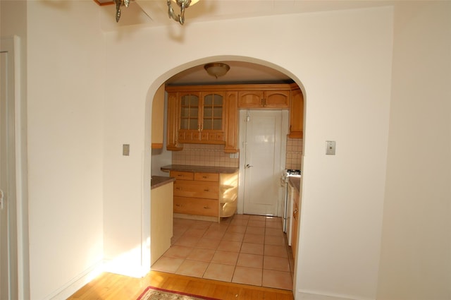 kitchen featuring tasteful backsplash and light wood-type flooring