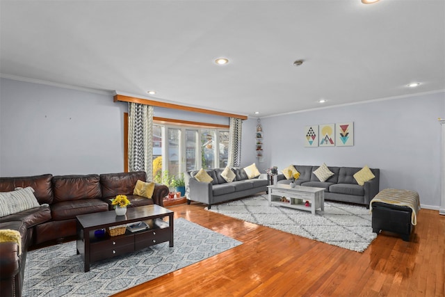 living area featuring recessed lighting, ornamental molding, and wood finished floors