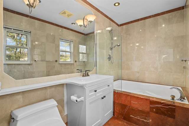 full bathroom featuring shower / bathing tub combination, toilet, tile walls, and vanity