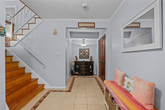 interior space with stairway, baseboards, and ornamental molding