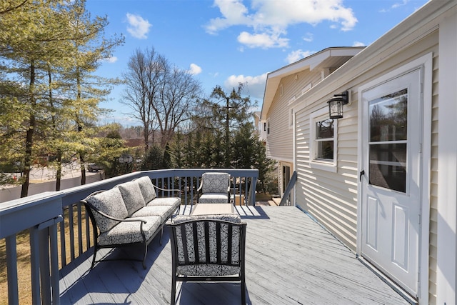 wooden terrace featuring an outdoor hangout area