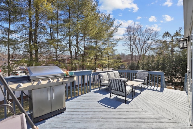 wooden deck featuring grilling area