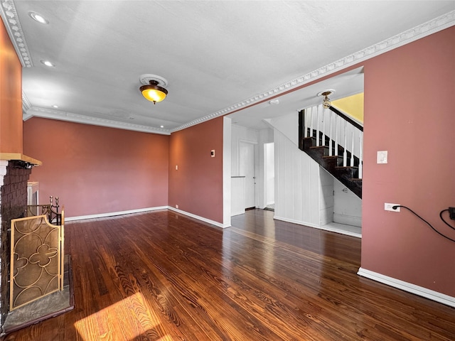 unfurnished living room featuring crown molding and hardwood / wood-style flooring