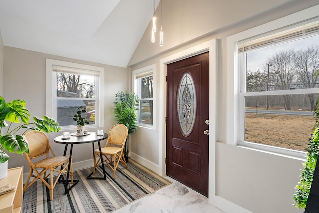 foyer entrance with lofted ceiling