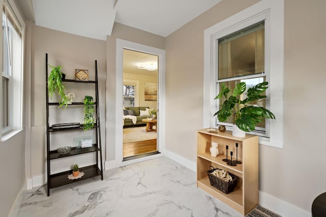 doorway to outside featuring plenty of natural light