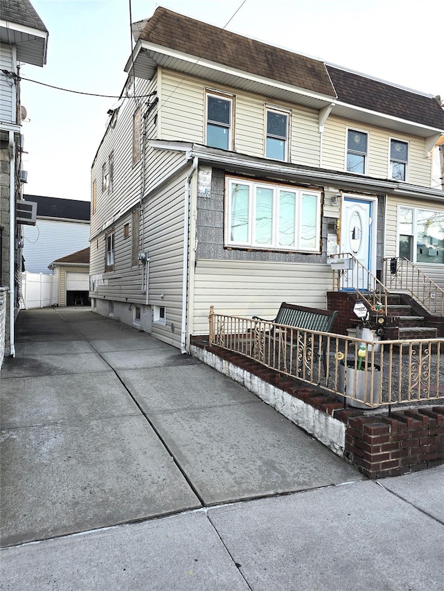 view of front of home with an outbuilding and a garage