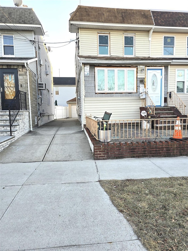 view of front of property with an outbuilding and a garage