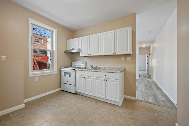 kitchen featuring white cabinetry, sink, light stone counters, and white range with electric stovetop