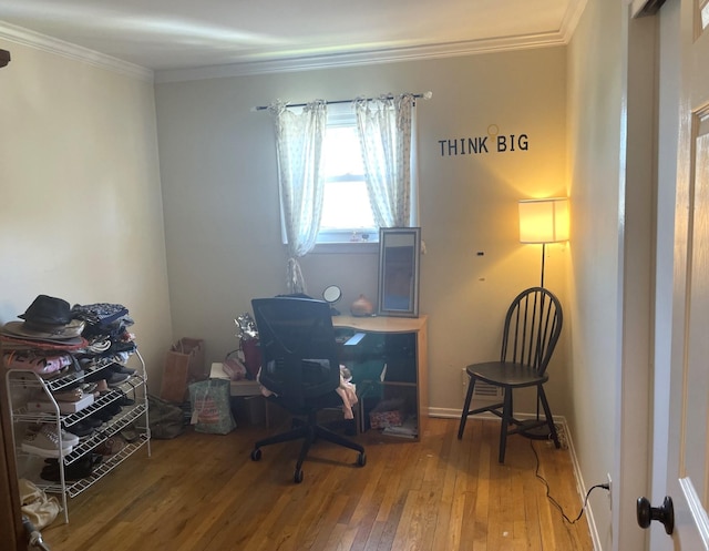 office with wood-type flooring and ornamental molding