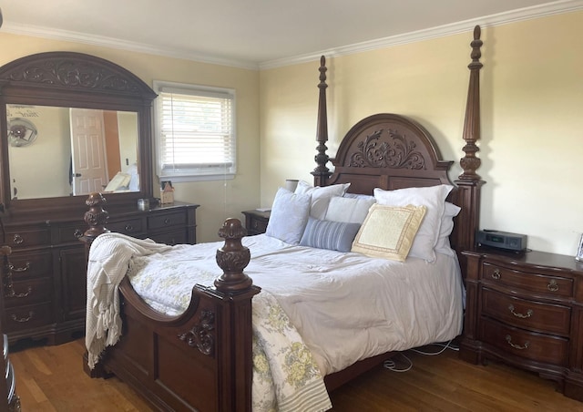 bedroom with wood-type flooring and ornamental molding