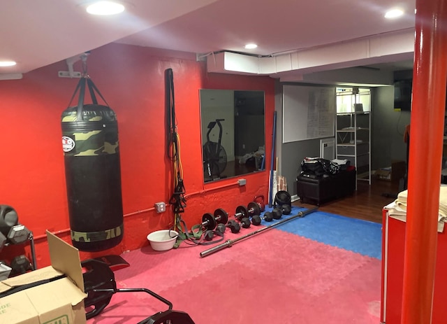 workout room with wood-type flooring