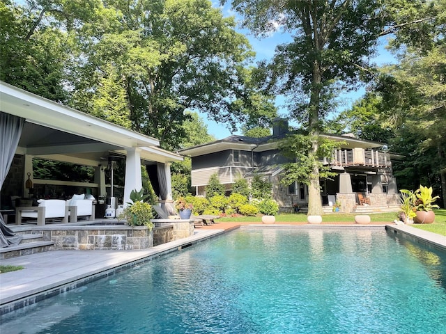 outdoor pool with a patio area