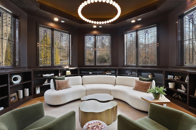 living area with a tray ceiling