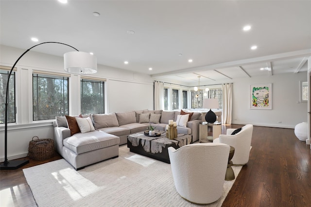 living room featuring beam ceiling, baseboards, wood finished floors, and recessed lighting