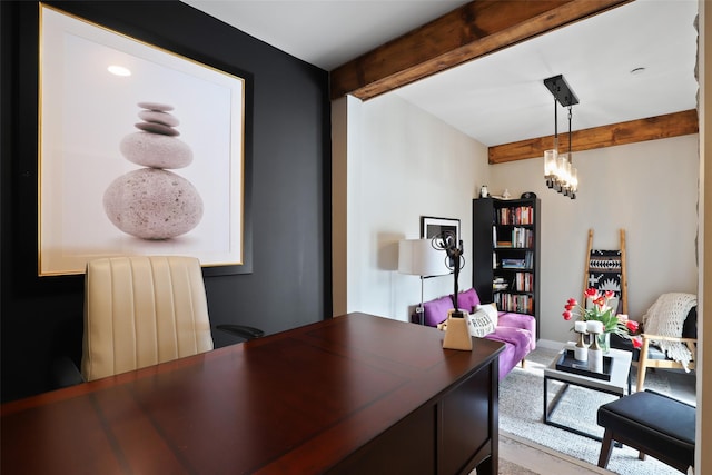 office space with a chandelier, beam ceiling, and baseboards