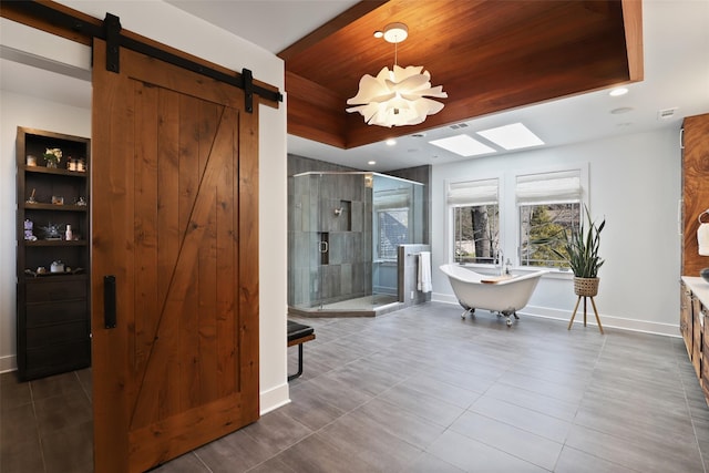 full bath with wood ceiling, baseboards, a soaking tub, a tray ceiling, and a stall shower