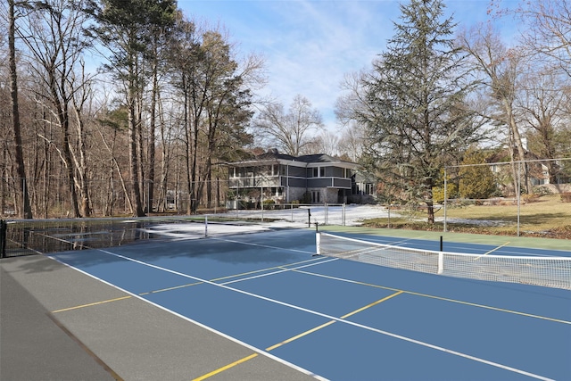 view of tennis court with fence