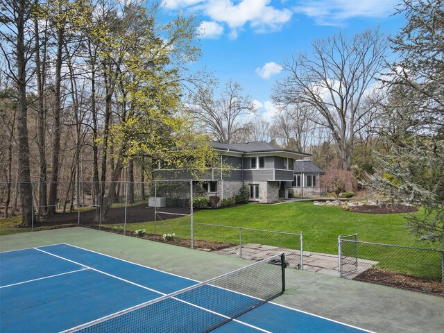 54 Lincoln Ave, Rye Brook, NY 10573 - view of tennis court featuring fence and a lawn