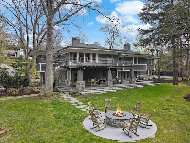 54 Lincoln Ave, Rye Brook, NY 10573 - rear view of house featuring a chimney, a yard, a patio, and an outdoor fire pit