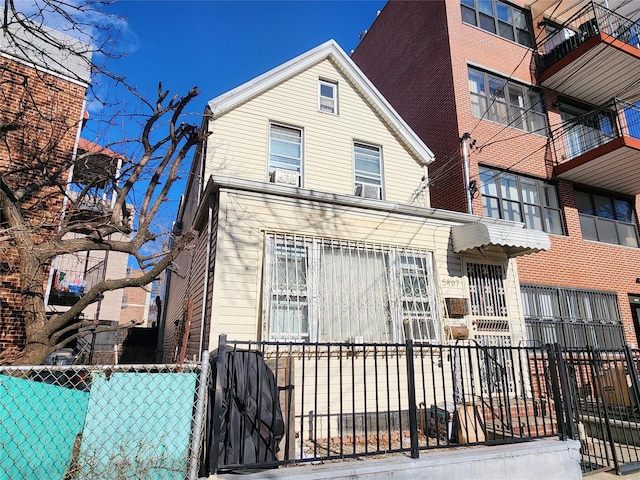 view of front of home with fence