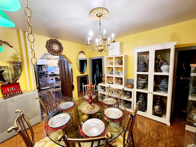 dining area featuring an inviting chandelier and arched walkways