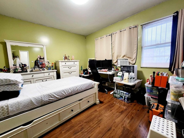 bedroom featuring wood finished floors