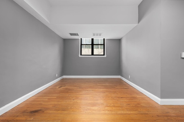 unfurnished room with light hardwood / wood-style floors