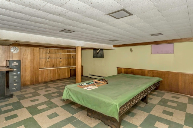 rec room featuring billiards, wainscoting, dark floors, wood walls, and a baseboard heating unit