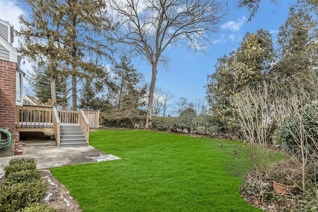 view of yard featuring a wooden deck