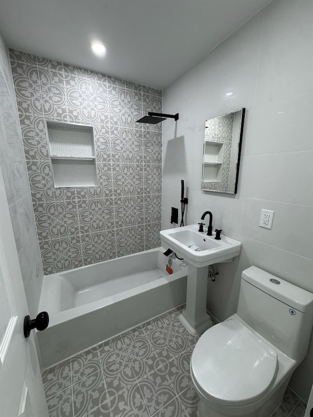 full bathroom featuring tile patterned flooring, tile walls, toilet, and  shower combination