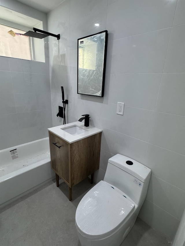 full bath featuring tile walls, tiled shower, toilet, and vanity