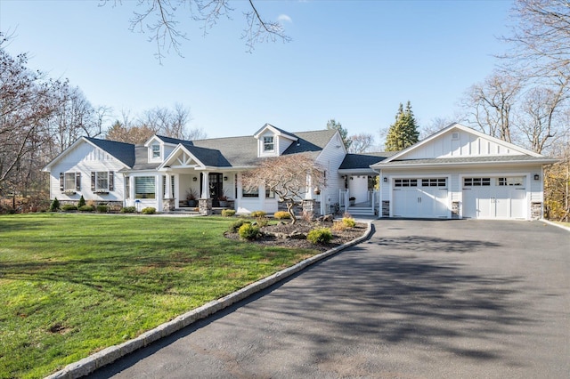 view of front of property with a garage and a front yard