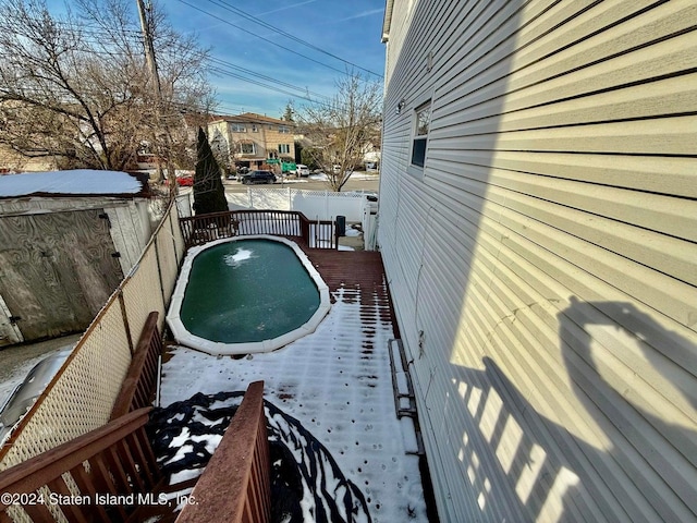 view of snow covered pool