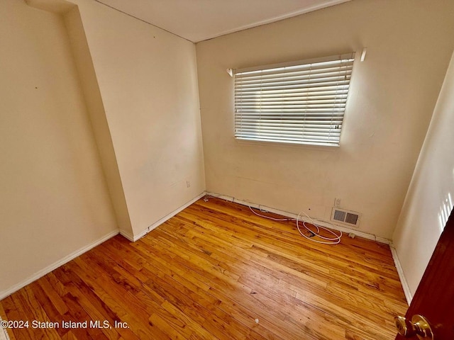 unfurnished room with light hardwood / wood-style flooring