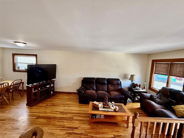 living room with light hardwood / wood-style flooring