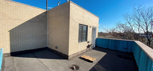 view of side of home with brick siding