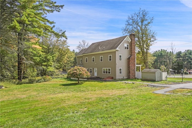 view of side of home featuring a shed and a yard