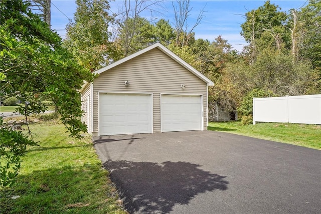 garage featuring a yard