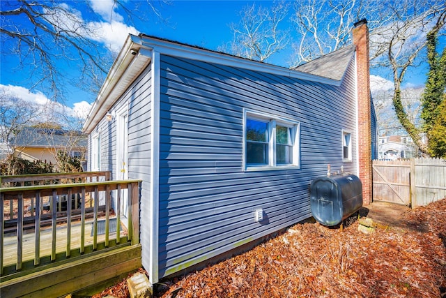 view of property exterior featuring a deck