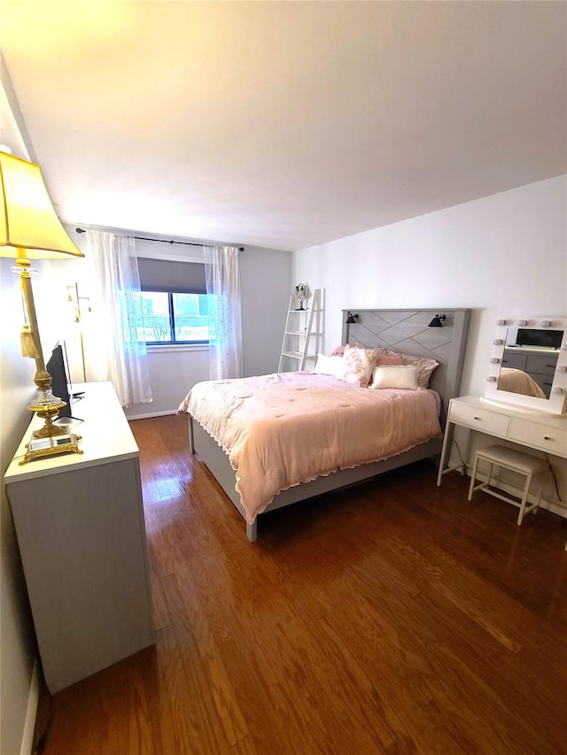 bedroom featuring dark hardwood / wood-style floors