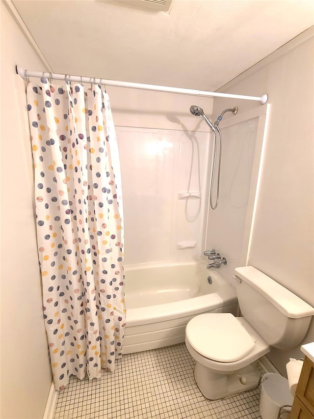 full bathroom featuring vanity, tile patterned floors, toilet, and shower / bath combo