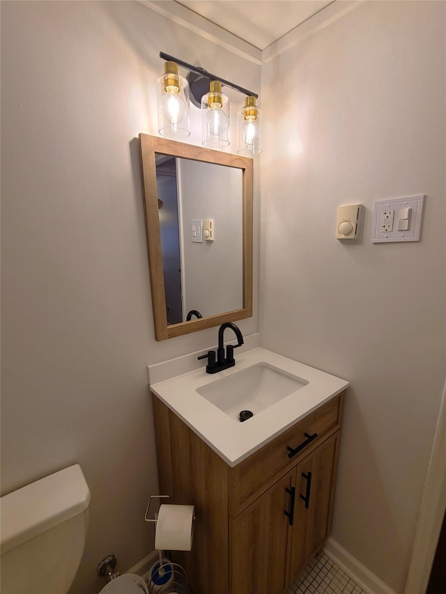 bathroom featuring vanity and toilet