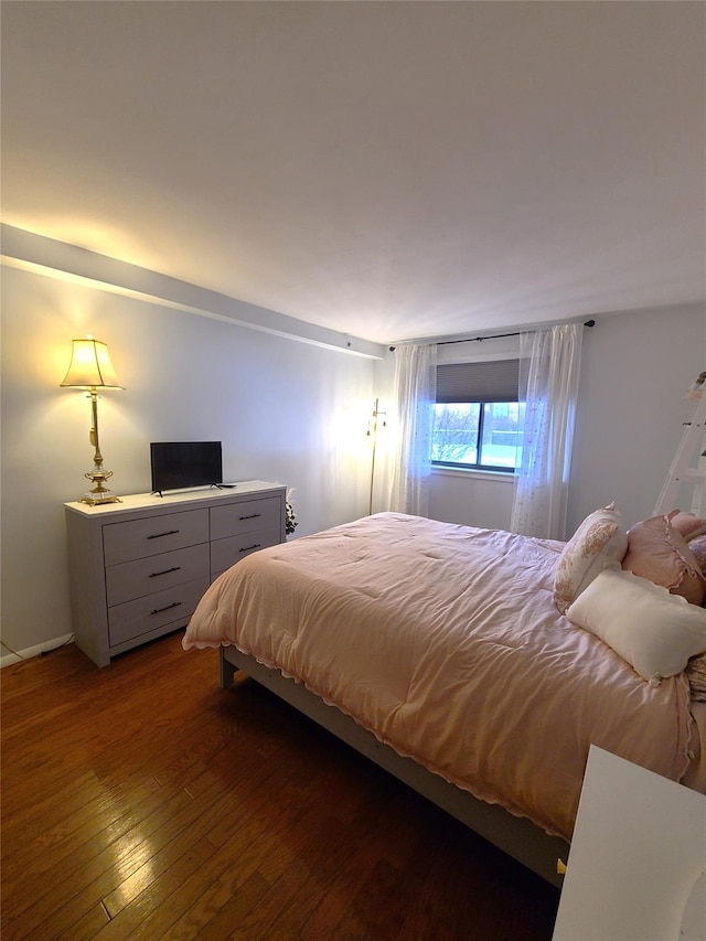 bedroom featuring dark wood-type flooring