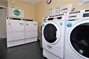 laundry area with washing machine and clothes dryer