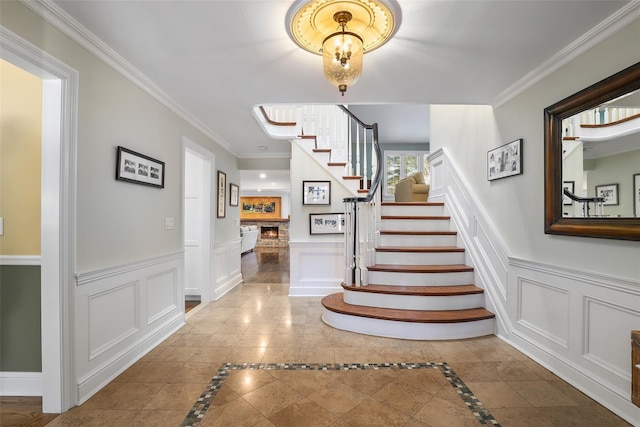 stairway featuring crown molding