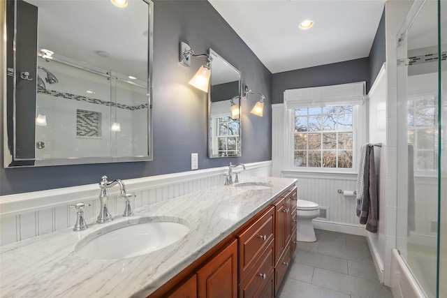 bathroom featuring tile patterned flooring, vanity, and toilet