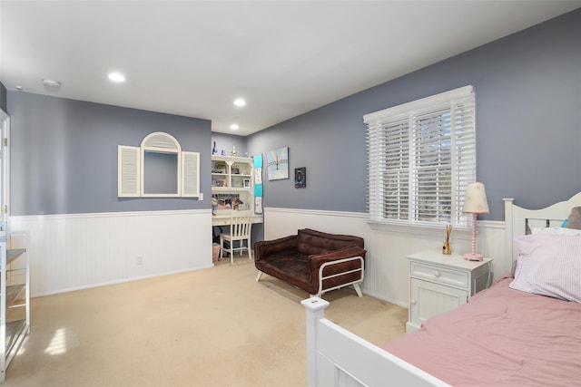 bedroom with light colored carpet